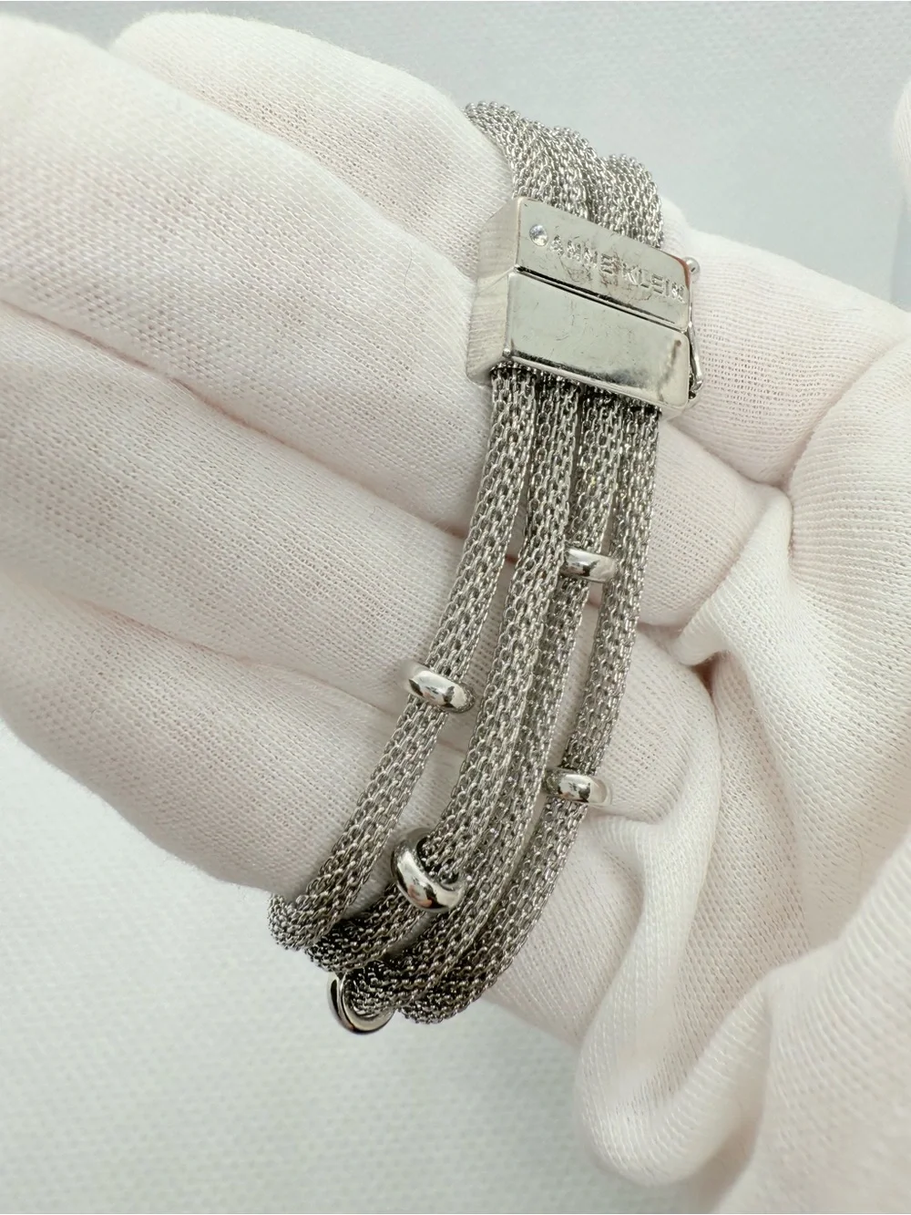Anne Klein Silver Layered Mesh Bracelet with Polished Rings